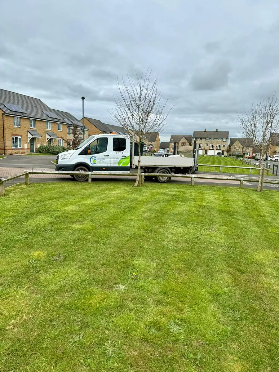 South West Bin Cleaning Co van parked beside a maintained green
